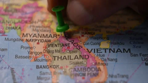 Close-Up World Map Shot Featuring Green Pin Highlighting Laos Pointed Stock Footage 333579882