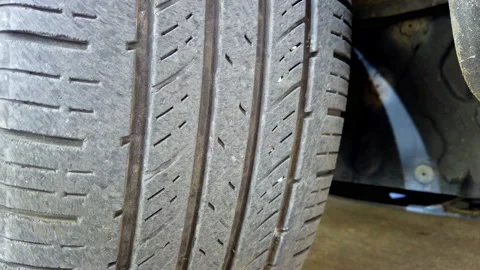 Close-up of a worn car tire for a road safety concept Stock Footage 217780922