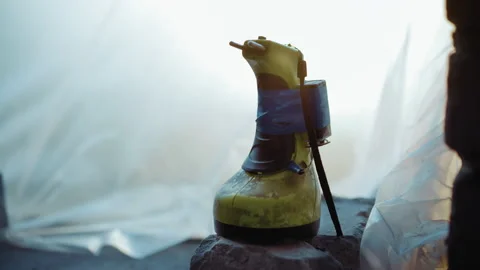 Close Up of Worn Electric Drill Wrapped With Tape on Rock Stock-Footage 347078406