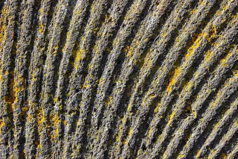 Close up of a worn millstone aging outside Stock Photos