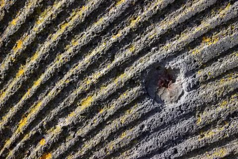 Close up of a worn millstone aging outside Stock Photos
