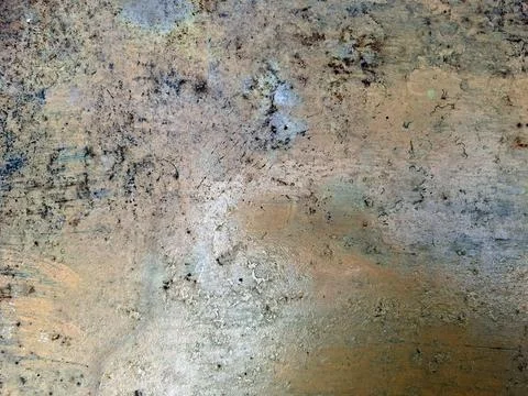 Close-up of worn paint and subtle rust spots on a flat metal surface. Stock Photos