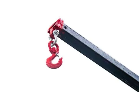 Close-up of worn, red handle attached by silver bolt on aged metallic devic.. Photos