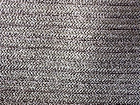 Close up of a woven fabric with a pattern of white and brown Stock Photos