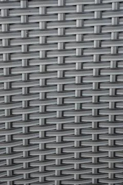 Close-up of a woven grey texture showcasing intricate patterns. The material Stockfoto's