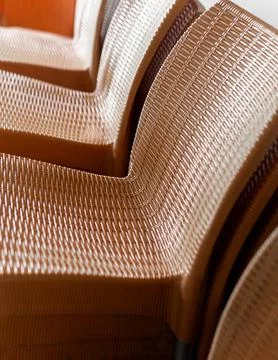 Close Up of Woven Pattern Plastic Chairs Stock Photos