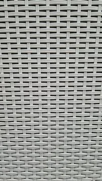 Close-up of woven plastic surface of laundry basket Stock Photos