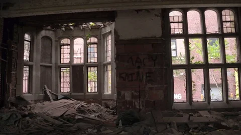 CLOSE UP: Wracked chapel and broken windows in abandoned City Methodist Church Stock Footage 76284146