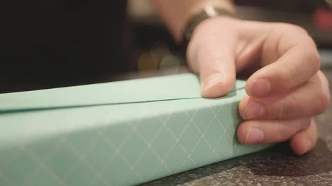 Close up wrapping a gift. Stock Footage 91780017