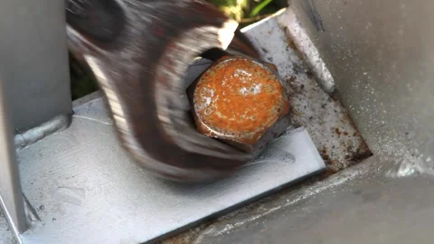 Close up of a wrench tightening a rusty nut Stock Footage 281948660