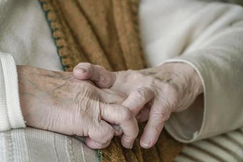 Close up wrinkled hands Stock Photos