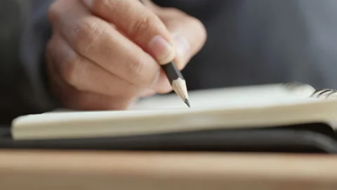 Close-up of writing on notebook with pencil Stock-Footage 153224937