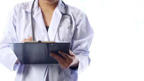 Close-up writing Young physician with stethoscope prescribes treatment to Stock-Footage 336587709