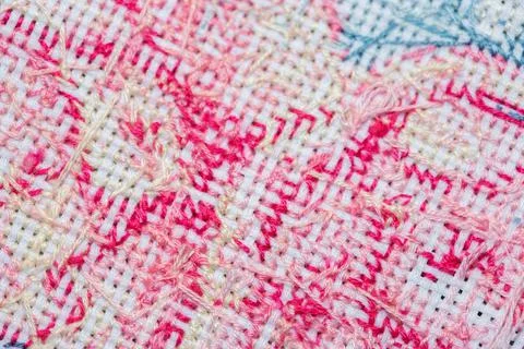 Close-up of the wrong side of a cross-stitched canvas with a pattern Foto stock