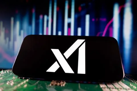 Close up of xAI logo on smartphone screen with financial chart background. Stock Photos