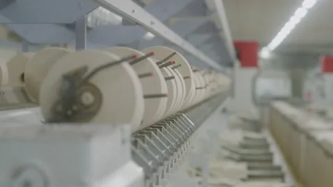 Close-Up of Yarn Spools in Textile Manufacturing Line with Depth of Field 库存影片 332541534
