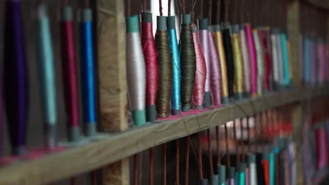 Close-up of a yarn warping machine in a textile weaving craftsmanship Stock Footage 305613818