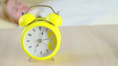 Close-up yellow alarm clock rings. Stock Footage 150487526
