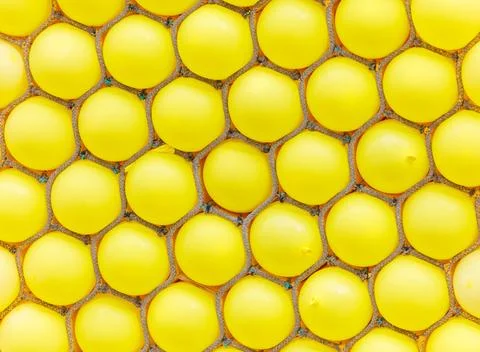 A close up of yellow balloons in a pattern Stock Photos