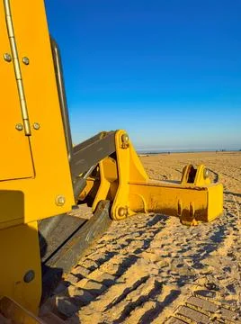Close-up of yellow bulldozer on sandy construction site Stock Photos