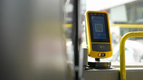 Close up of yellow card reader with qr code near the bus driver for Istanbulkart Stock Footage 280530254