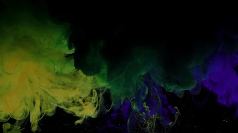 Close-up of yellow green and blue paint sprayed under water Stock Footage 114320249