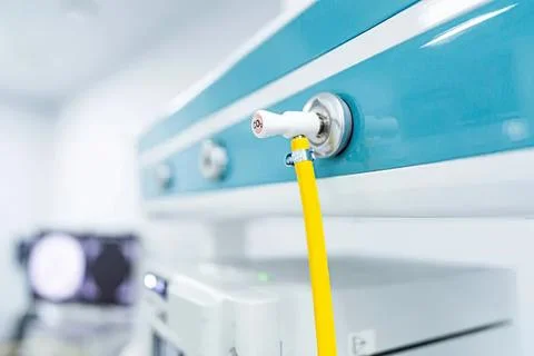 Close-up of a yellow hose connecting to a machine Stock Photos