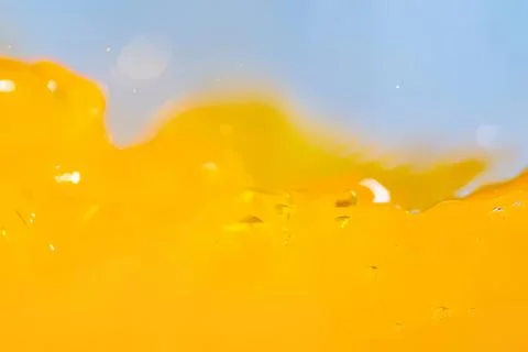 Close-up of yellow juice splash with bubbles and liquid movement Stock Photos