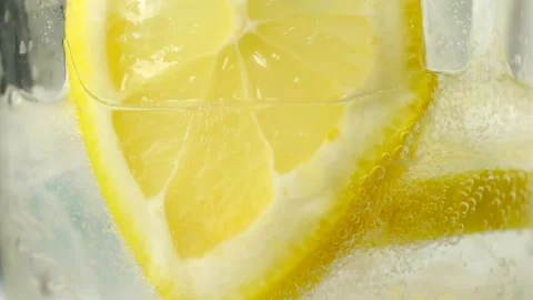 Close-up of yellow lemonade with ice cubes Stock Footage 241090426