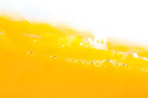 Close-up of a yellow liquid with bubbles and foam Stock Photos