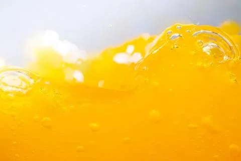 Close-up of yellow liquid with bubbles and foam Stock Photos