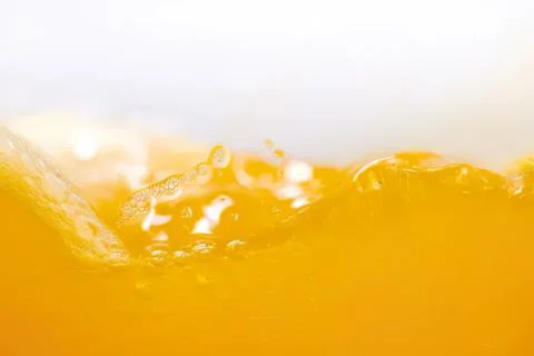 Close-up of yellow liquid with bubbles and foam Stock Photos