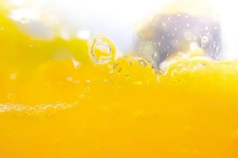 Close-up of yellow liquid with bubbles and foam Stock Photos