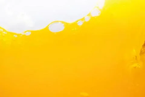 Close-up of yellow liquid with bubbles and foam Stock Photos