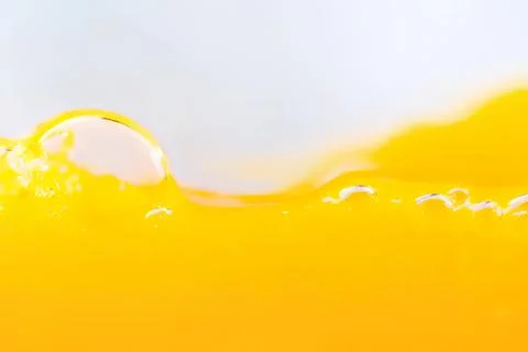 Close-up of yellow liquid with bubbles and splash Stock Photos