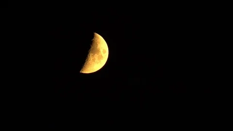 Close-up of yellow moon in cloudless night sky Stock Footage 118765947