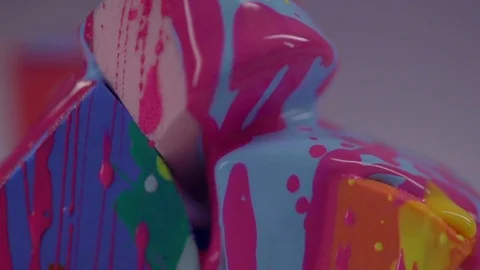 A close-up of the yellow nail polish flows down the lacquer on the sponge. Stock Footage 77512202