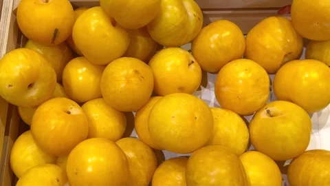 Close up of yellow nectarines in a basket Stock Footage 305866127