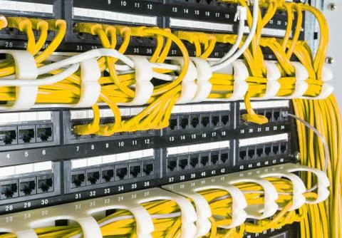 Close up of yellow network cables connected to switch Foto stock