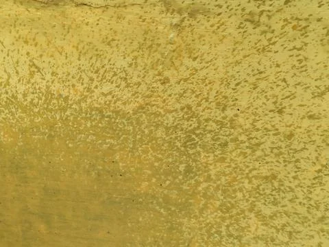 Close-up of a yellow painted wall surface with natural rainwater splash marks Stock Photos