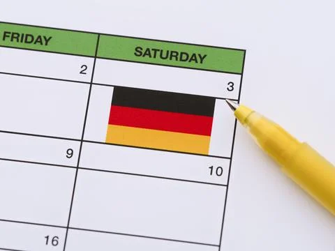Close-up of a yellow pen points to the Day of German Unity date of October 3r Stock Photos