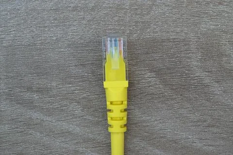 Close-up of yellow RJ45 Ethernet network connector plug Stock Photos