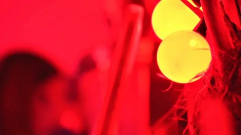 Close up of yellow round mated bulbs and a little shiny mirror in a red lighting Stock Footage 123216967