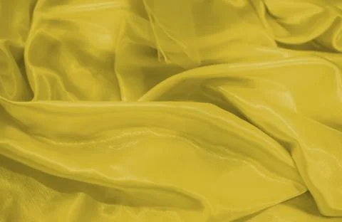 Close up on yellow silk material background or texture Fotos Stock