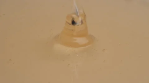 Close up of yellow thick syrup pouring. Stock Footage 201338560