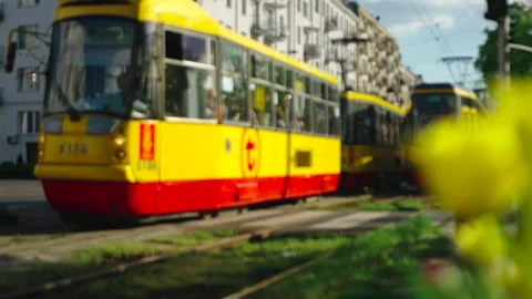 Close-up of yellow tram passing camera, Warsaw 動画素材 338324881