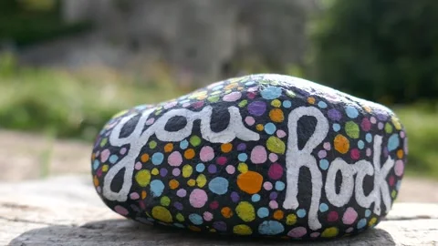 Close-up of you rock inspirational painted kindness rock Vidéo 252952495
