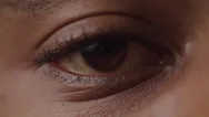 Close Up Of Young Adult African American Male Eye Looking Into Camera Stock Footage