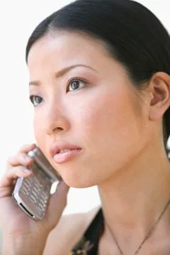 Close up of young adult woman talking on cell phone Stock Photos