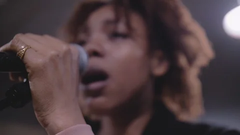 Close up of young African singer singing on stage Stock Footage 105092968